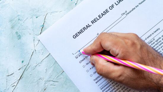 Person,Filling,General,Release,Of,Liability,Form,Paper,On,Bright