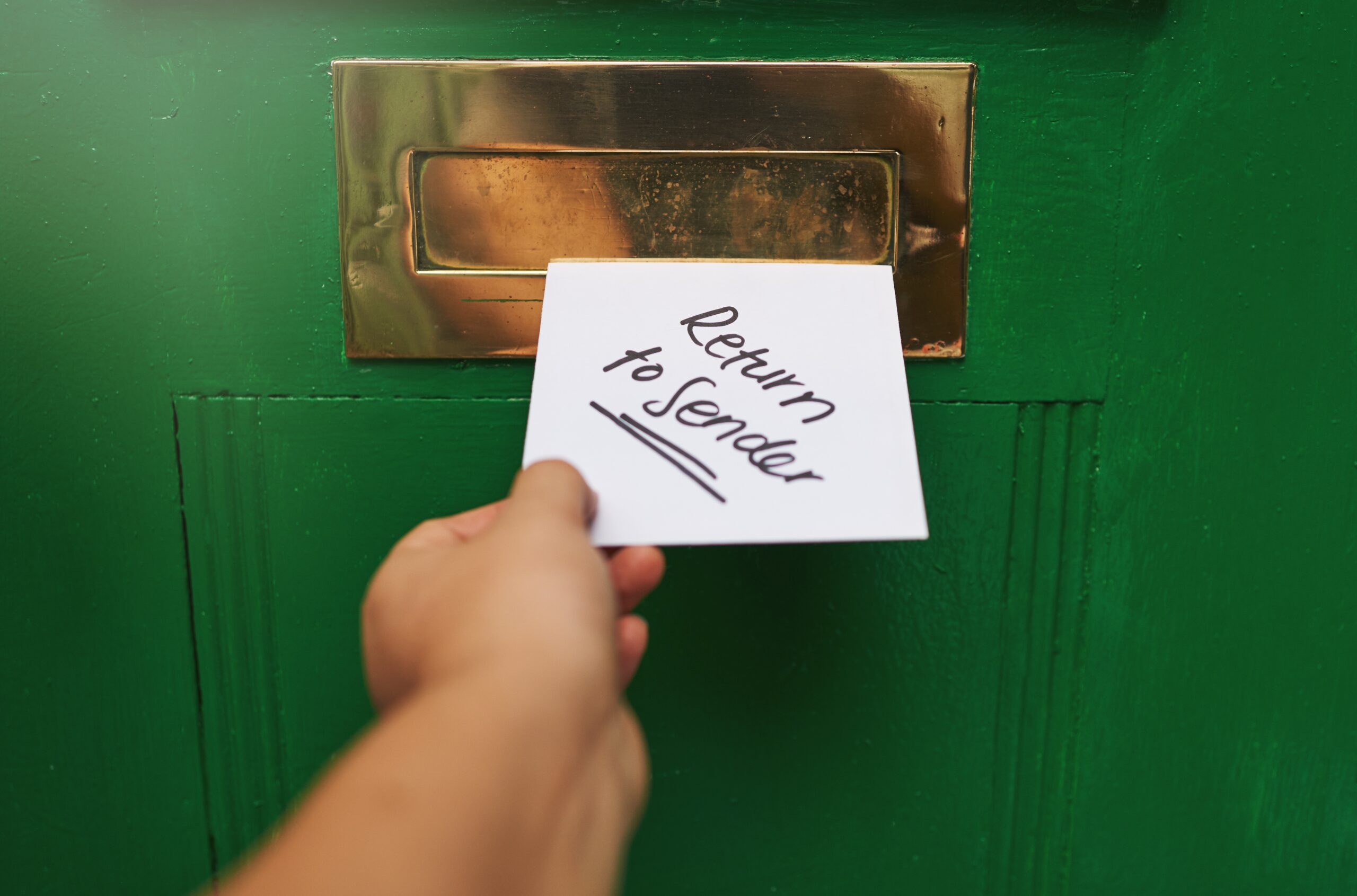 Return,To,Sender.,Cropped,Shot,Of,A,Person,Inserting,A