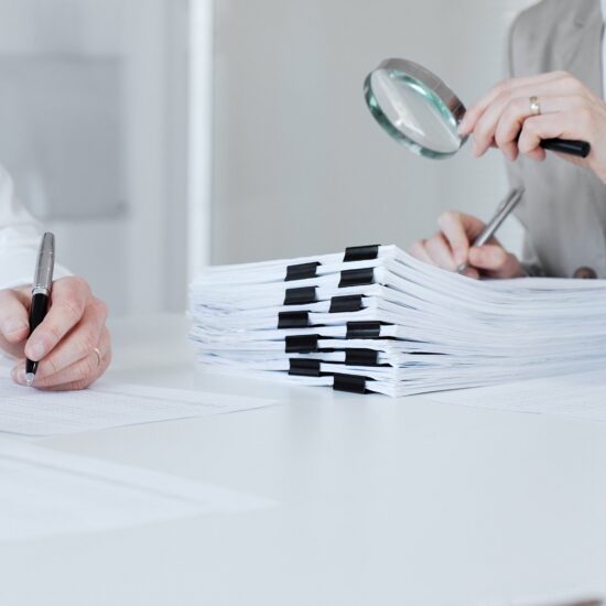 Auditors,And,Financial,Experts,Analyzing,Tax,Documents,,Reviewing,Contract,Papers,